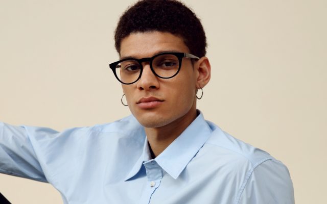 A person wearing IXI autofocus glasses that look like ordinary eyewear