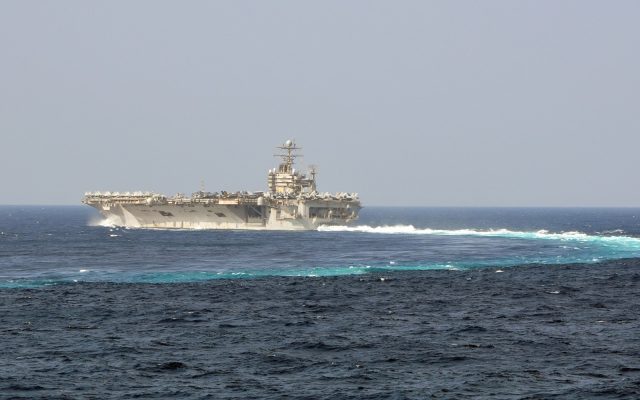 The aircraft carrier USS Abraham Lincoln underway at sea, viewed from off its port side
