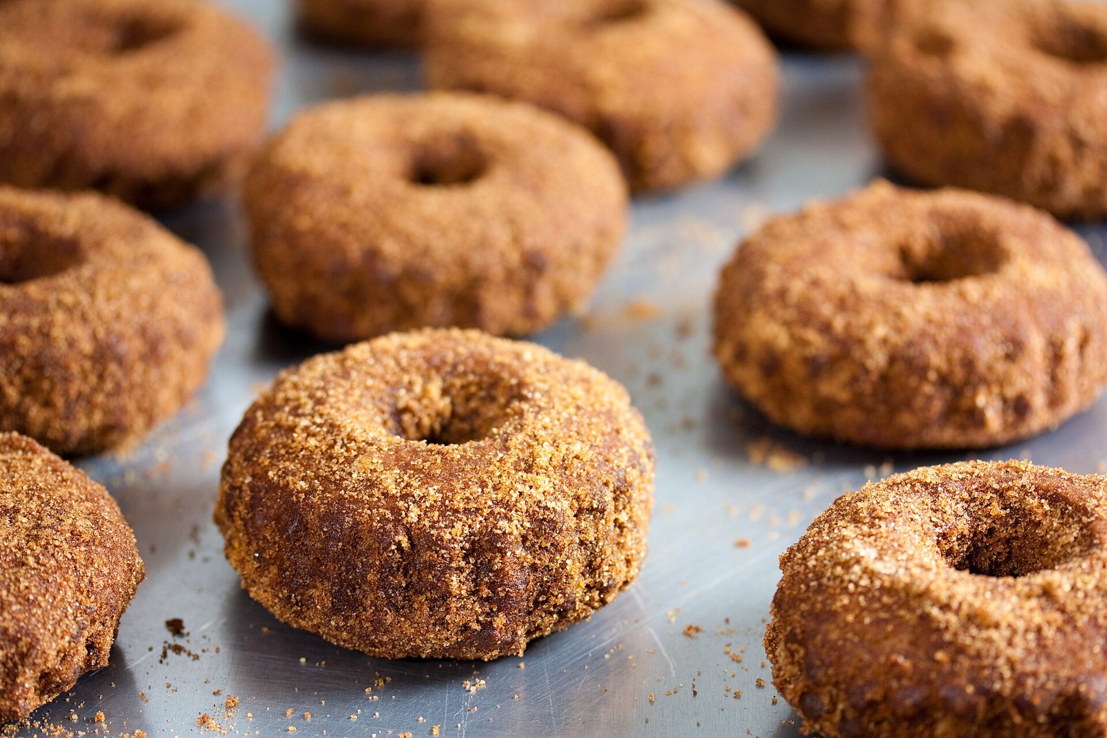 A tray of sugar-coated apple cider donuts
