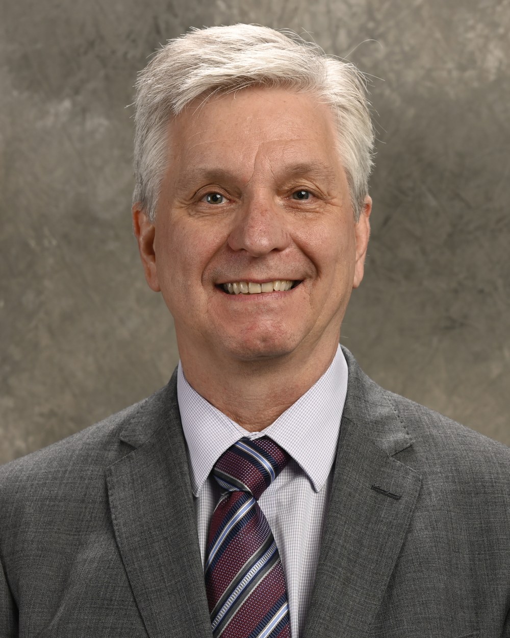 Federal Reserve Governor Christopher Waller in a gray suit, an official portrait.