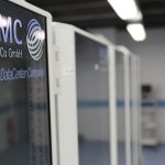 A tall rack of networking and server hardware, densely packed with cabling and status lights.