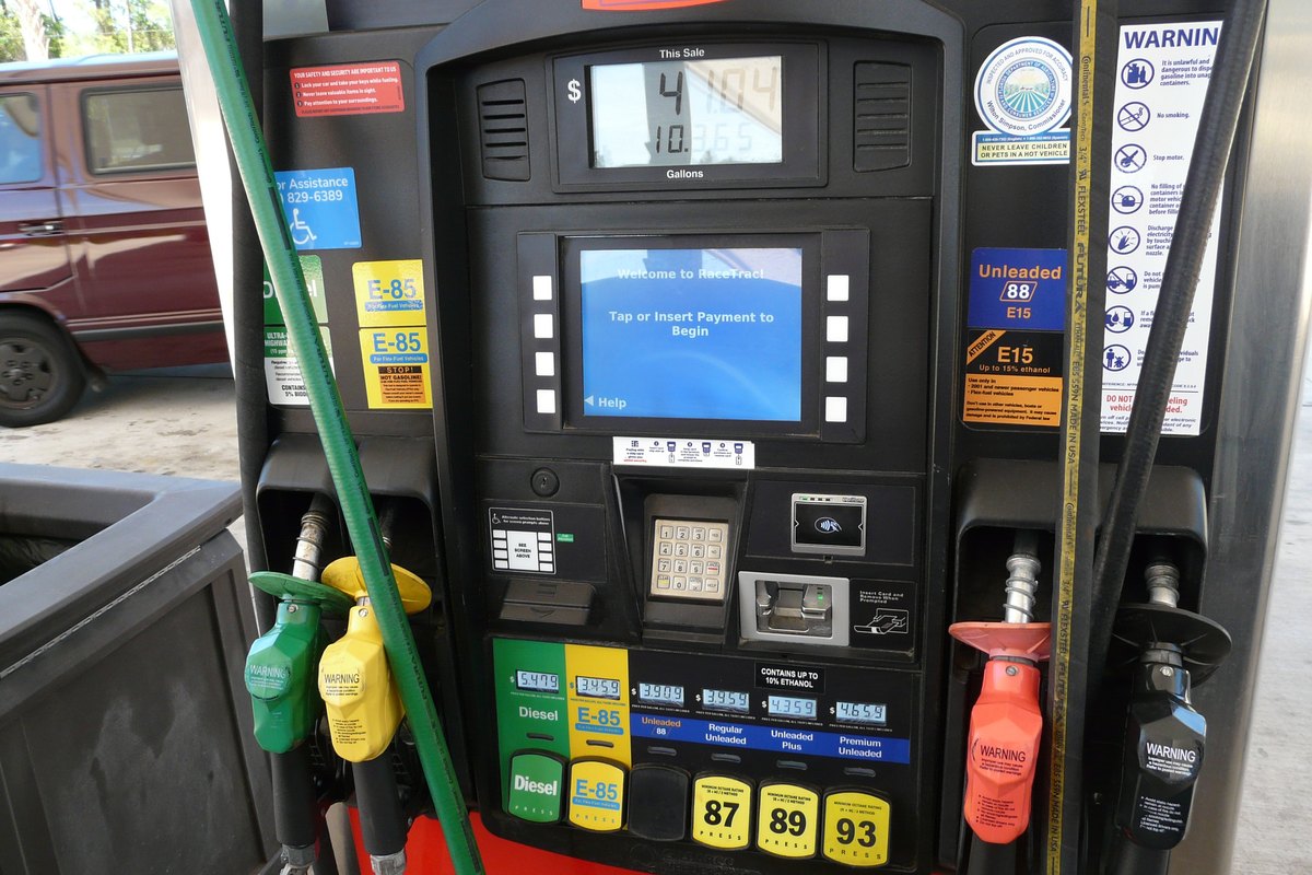 A fuel pump with a diesel nozzle and posted grade prices at a Florida station.