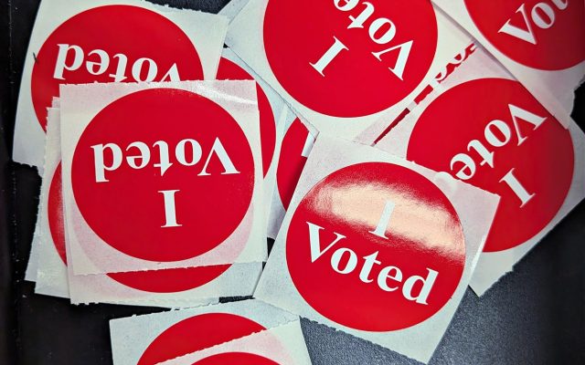 A pile of red, white and blue I Voted stickers.
