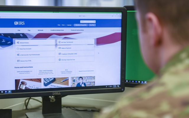A U.S. Army soldier views the IRS website on a desktop computer during tax season.