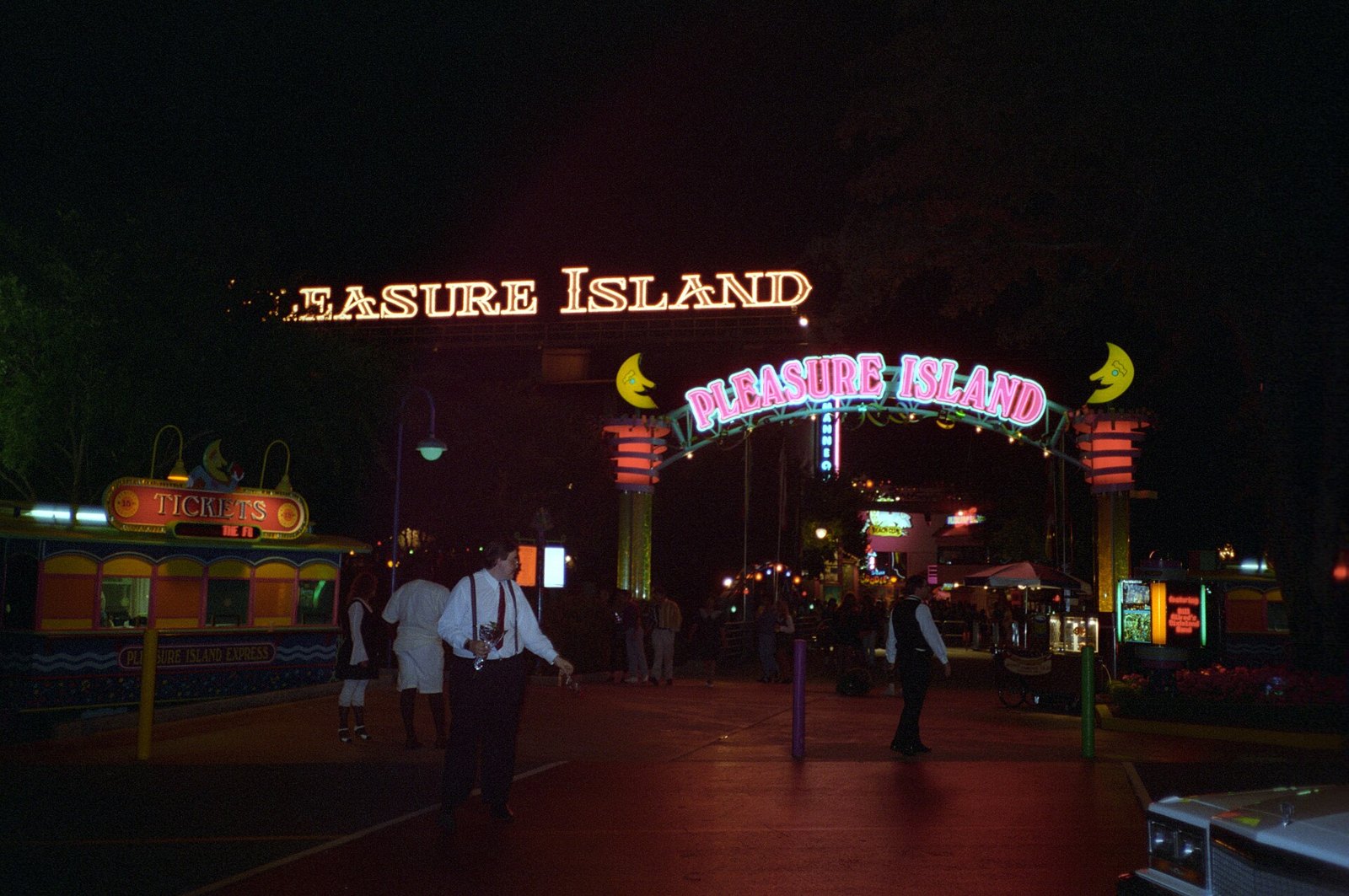The neon Pleasure Island entrance signs at night at Walt Disney World in 1995