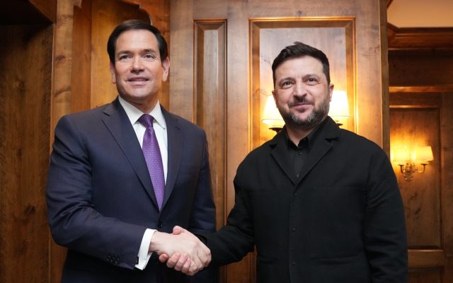 Secretary of State Marco Rubio shakes hands with Ukrainian President Volodymyr Zelenskyy in a wood-paneled room